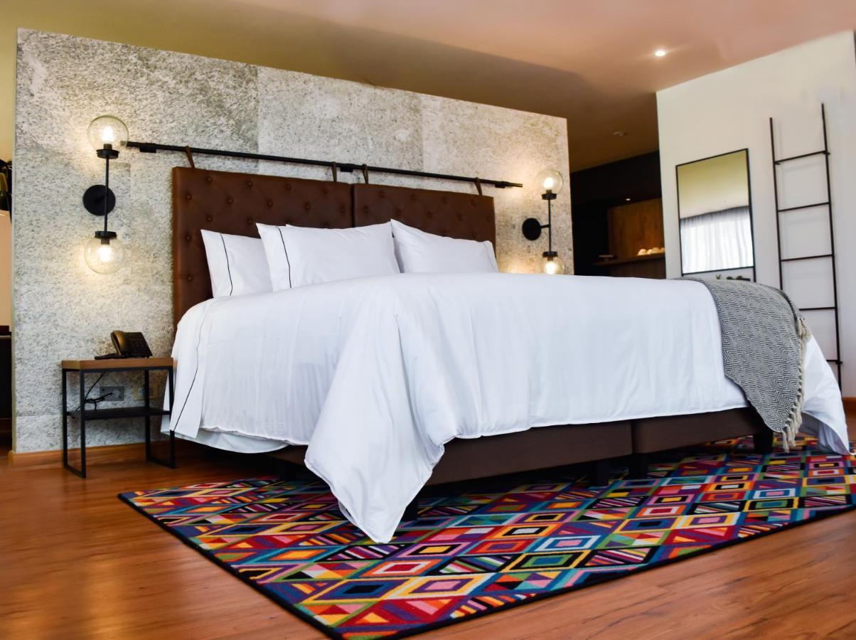 Hotel V1501 Pasto Kültér fotó A bedroom with a carpet