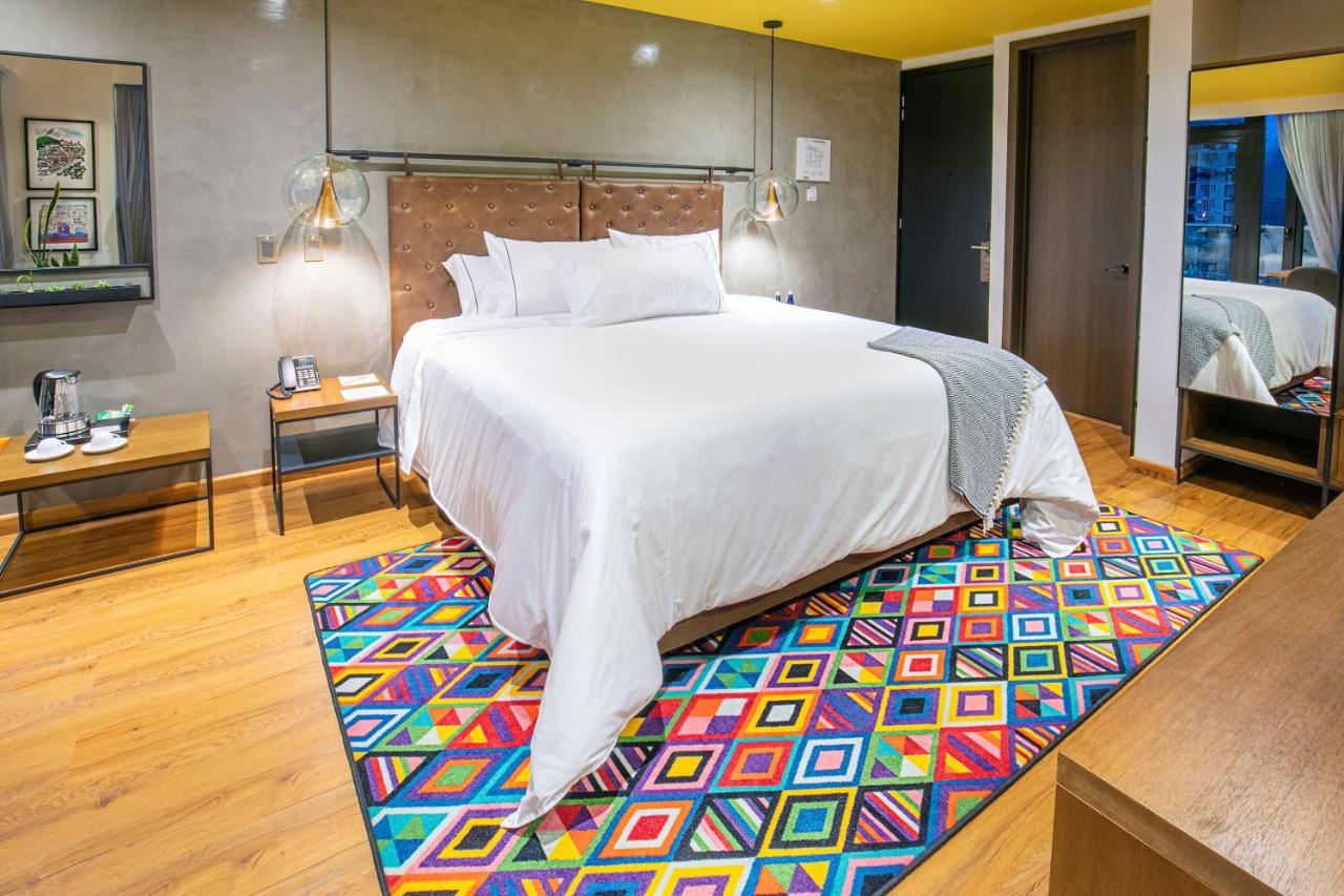Hotel V1501 Pasto Kültér fotó A carpet in a bedroom